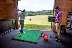 Alister Tawse and student in golf teaching studio at Lanhydrock Hotel and Golf Club